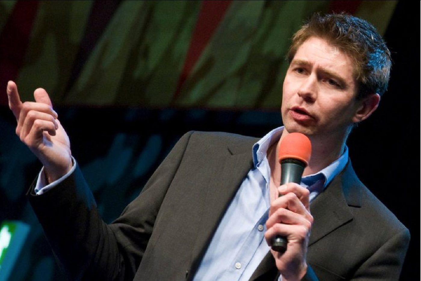 Silas J. Lees speaking on stage